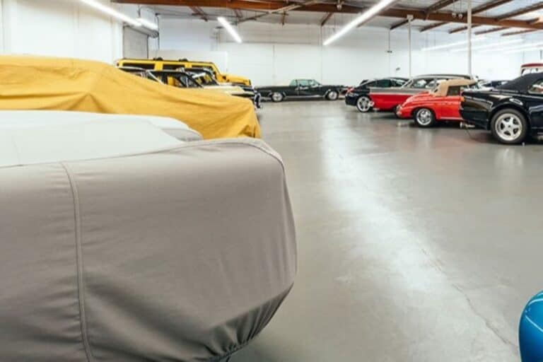 An indoor car storage with multiple cars parked